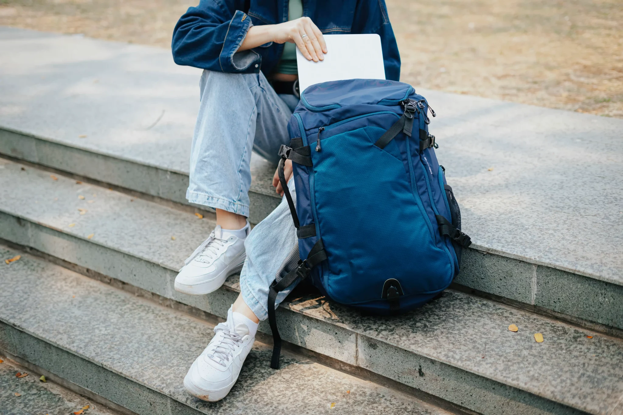 A women take the laptop from backpack