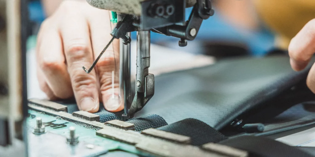 Nylon vs. Polyester Fabric for School Backpack Abrasion Resistance: A Sourcing Guide